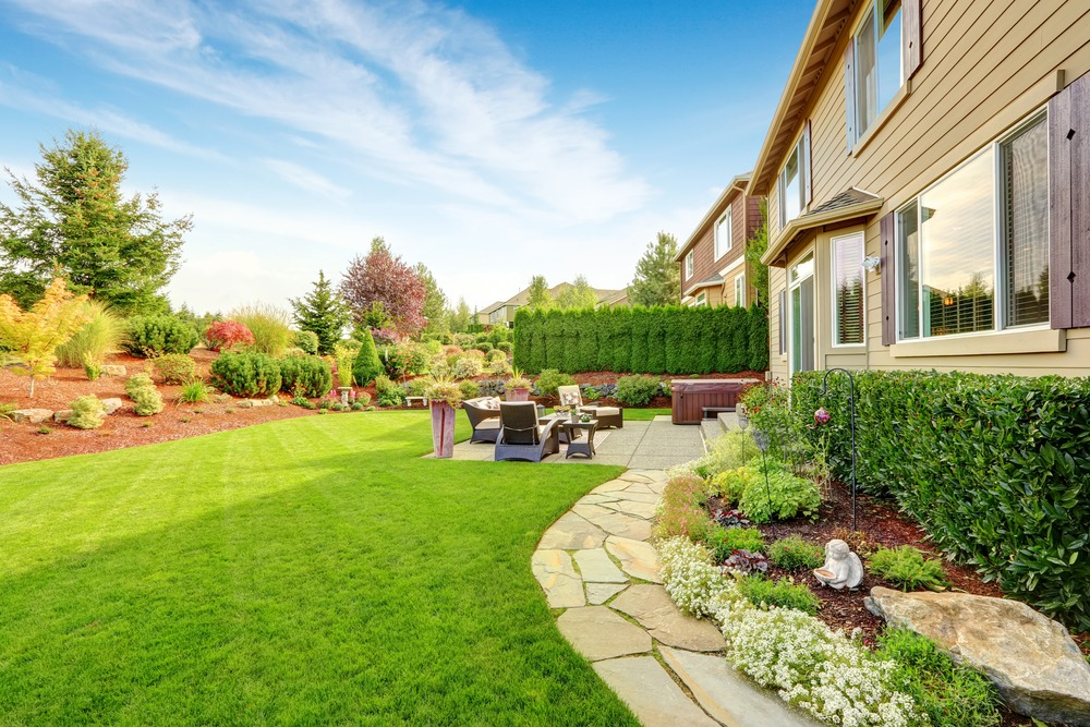 Original backyard with a smaller patio and natural stone path